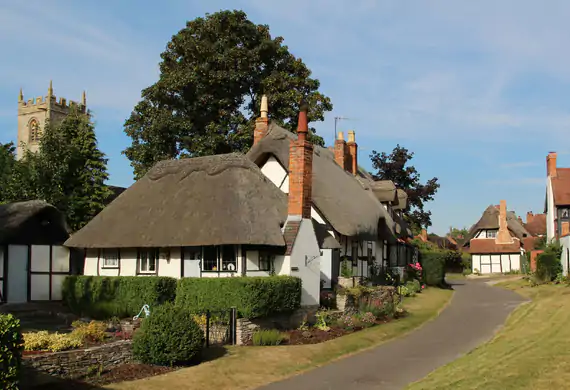 Thatched cottage in the English chalkstream countryside